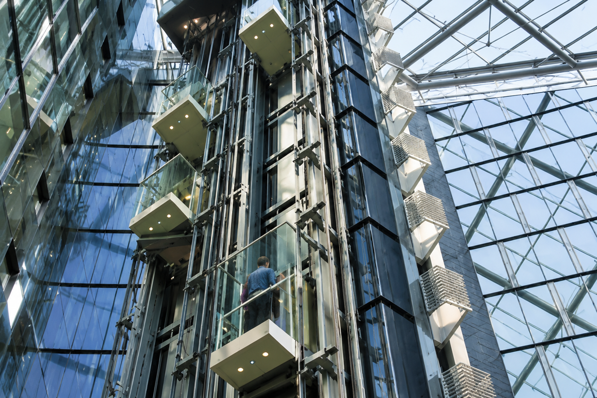 Atrium interior with multiple glass elevator shafts